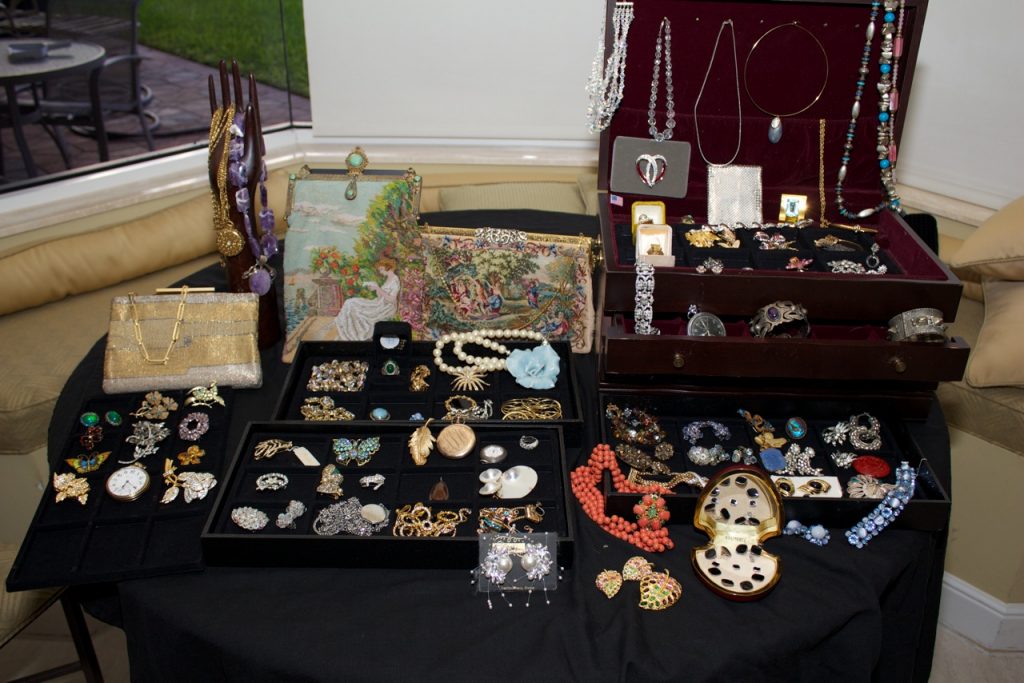 vintage jewelry set out at an estate sale