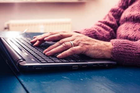 woman on laptop looking for estate sale company